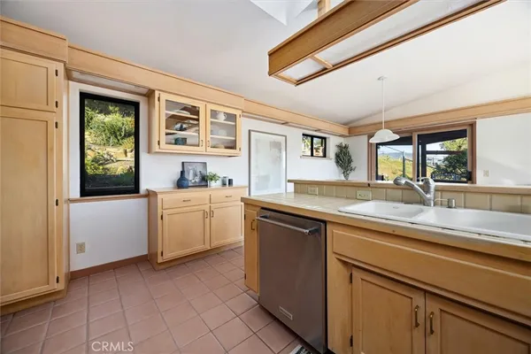 a kitchen with a stove and cabinets