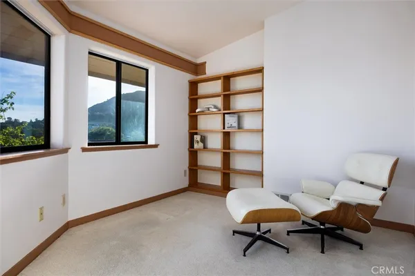 a living room with a flat screen tv and a table