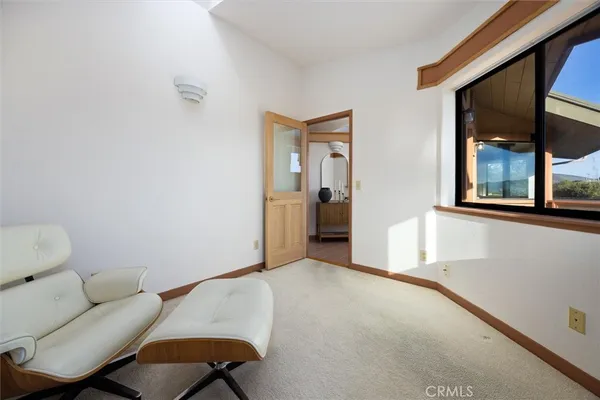 a bedroom with double bed and a window