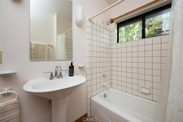a kitchen with a sink and a refrigerator