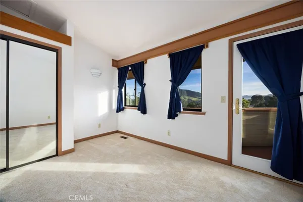a view of a hallway with staircase