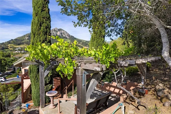 a view of balcony with table and chairs