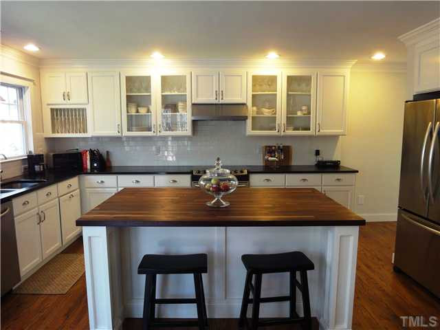 2020 Corberrie Lane Raleigh, NC 27613 - Photo 3 of 15 New Kitchen with huge island, roll out shelving, stainless steel appliances Kitchen