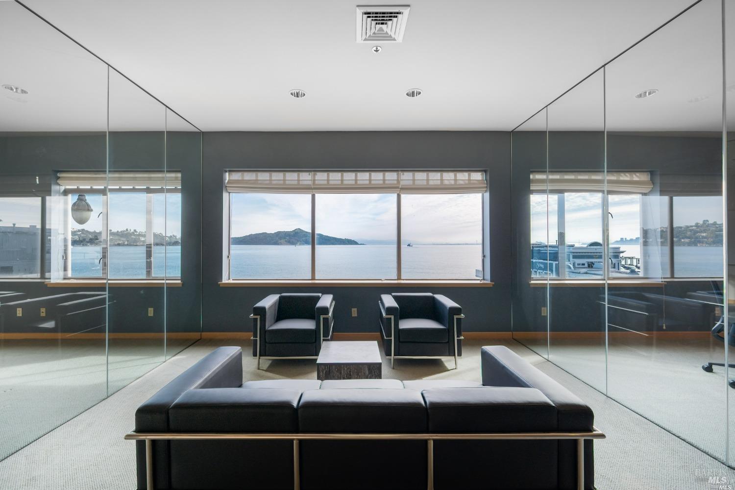 599 Bridgeway Sausalito, CA 94965 - Photo 14 of 37 a living room with furniture and a floor to ceiling window