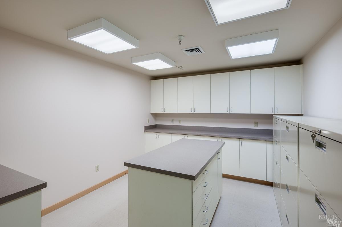 599 Bridgeway Sausalito, CA 94965 - Photo 17 of 37 a kitchen with a sink and cabinets