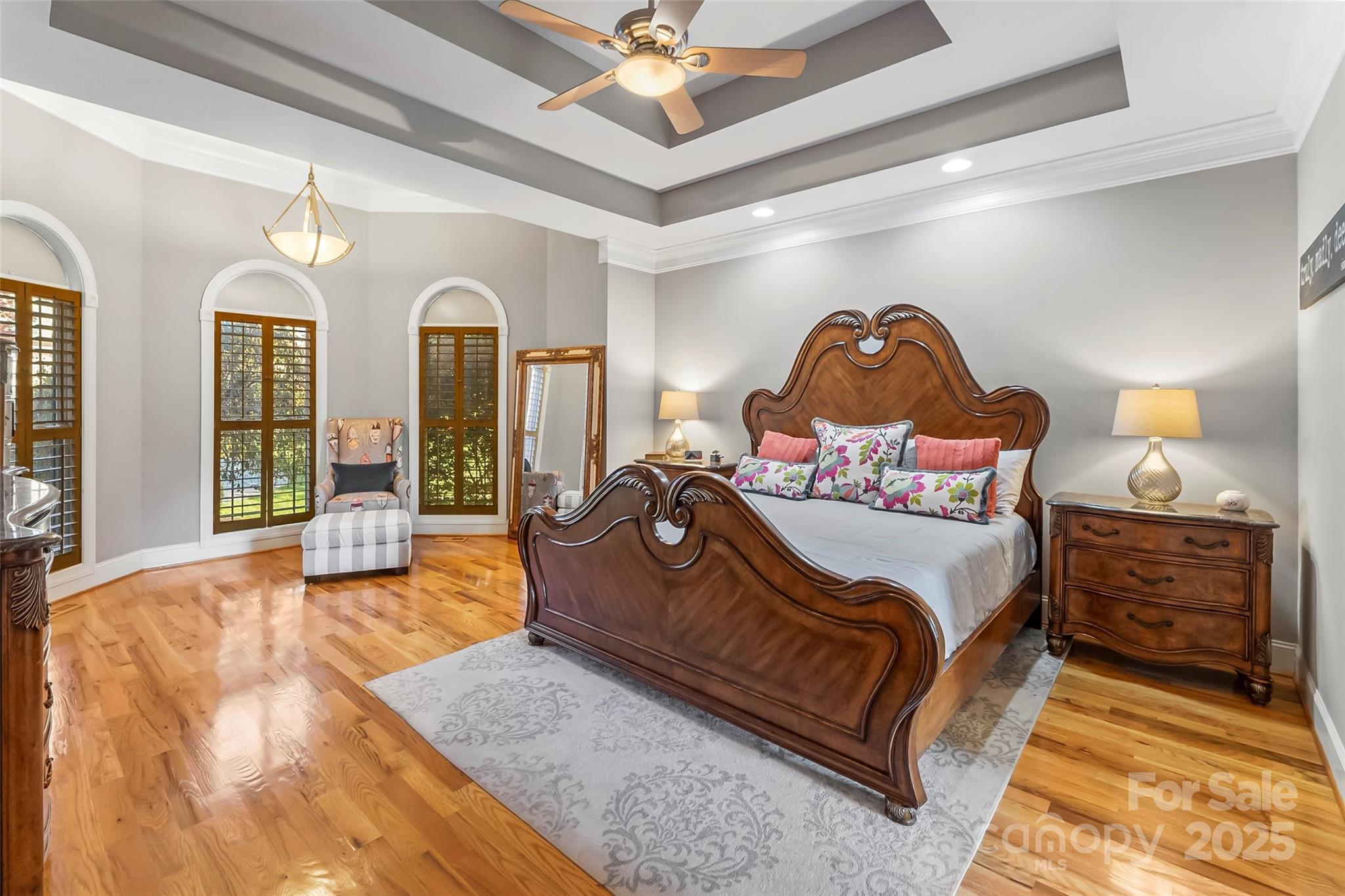 5836 Bakers Point Hickory, NC 28602 - Photo 16 of 48 a spacious bedroom with a bed a dresser and large mirror