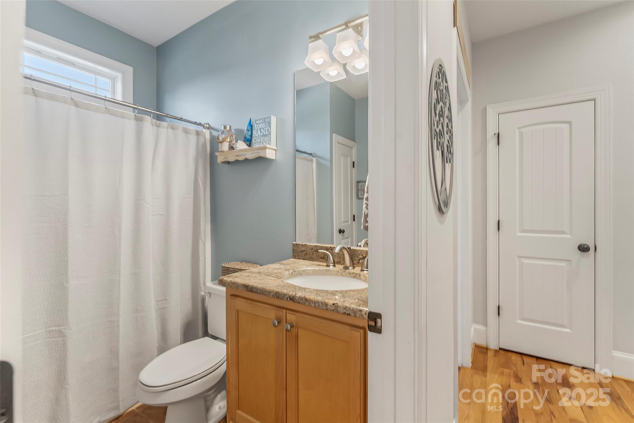 5836 Bakers Point Hickory, NC 28602 - Photo 22 of 48 a bathroom with a granite countertop sink toilet and shower