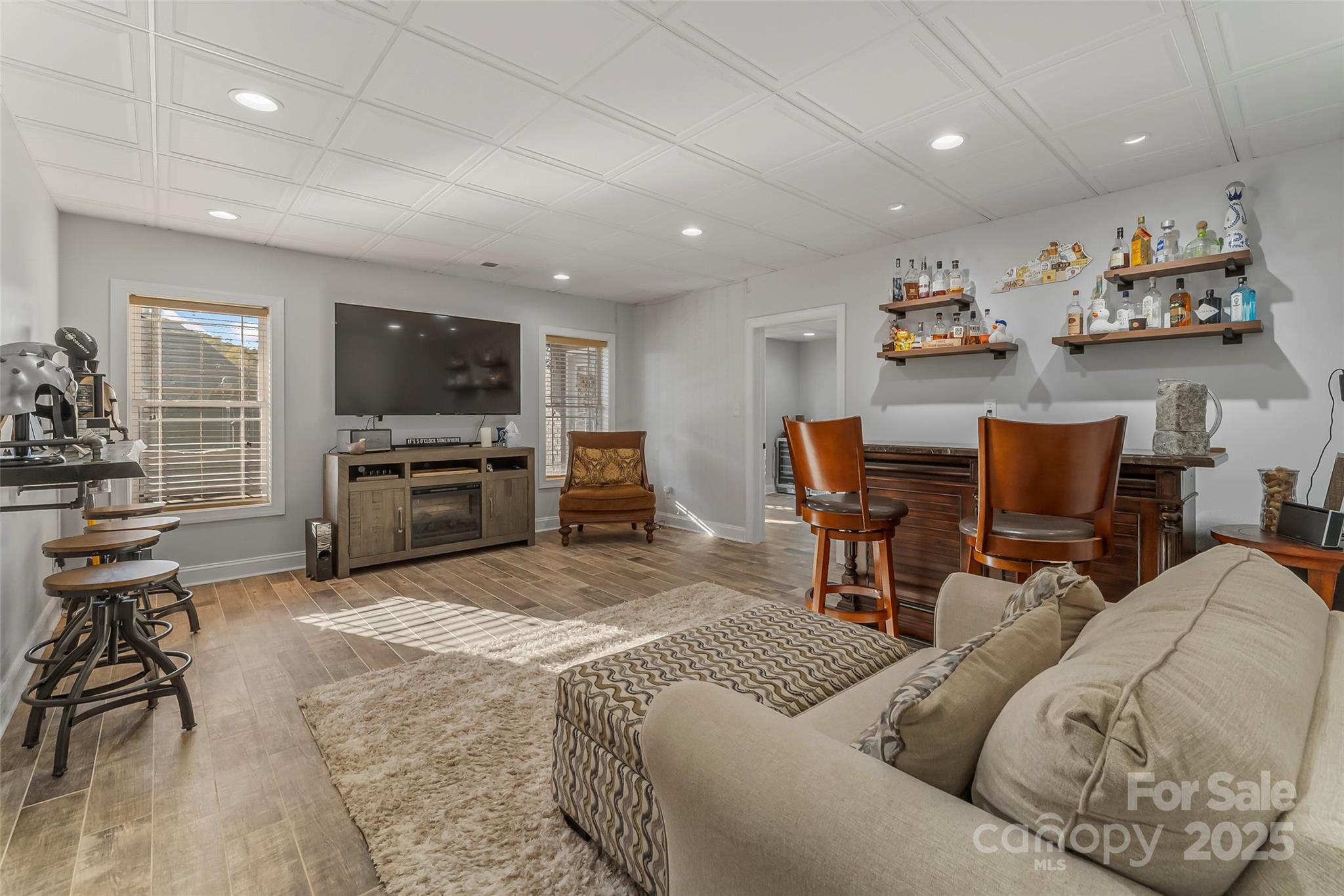 5836 Bakers Point Hickory, NC 28602 - Photo 31 of 48 a living room with furniture and a flat screen tv