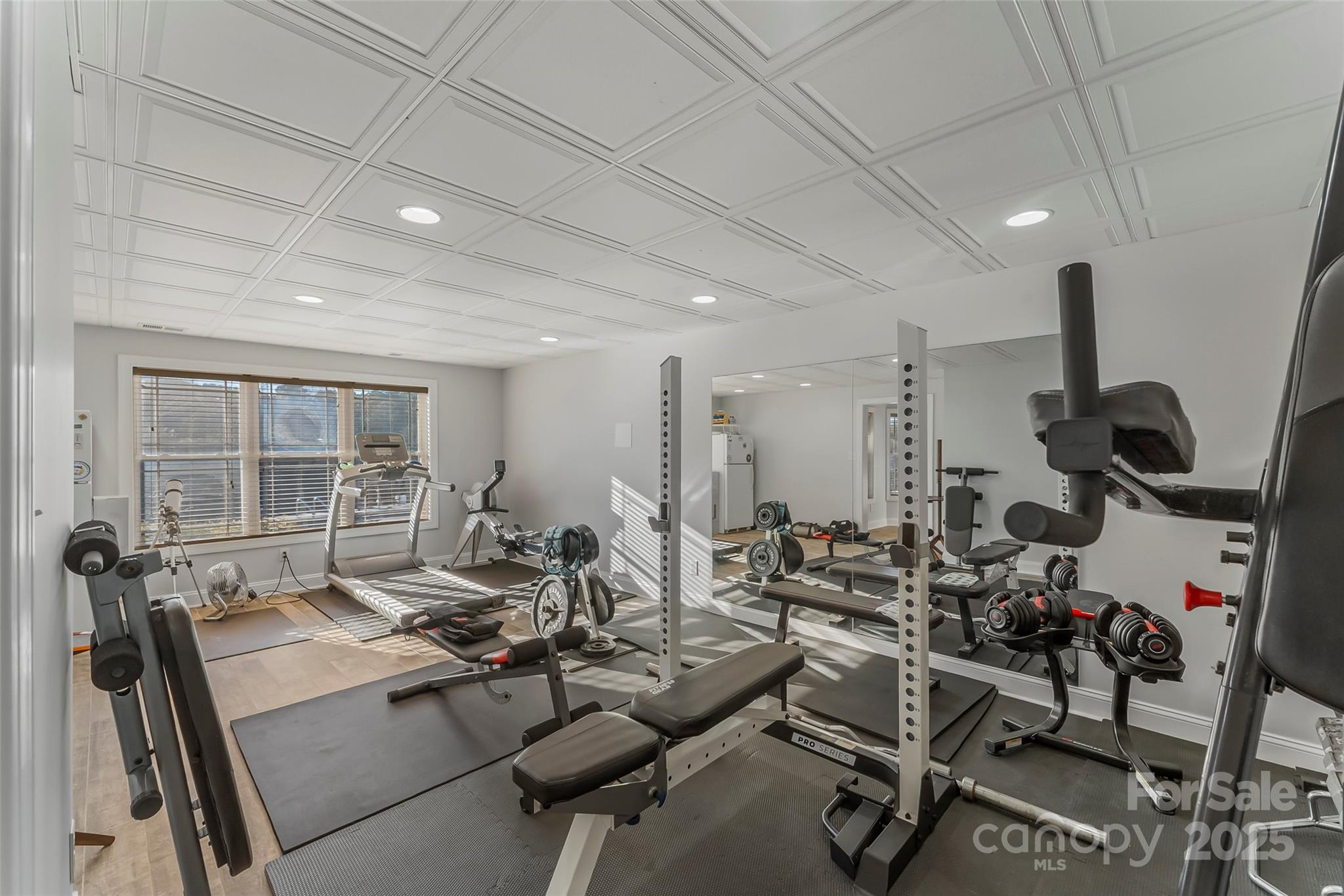 5836 Bakers Point Hickory, NC 28602 - Photo 33 of 48 a room with gym equipment and large windows