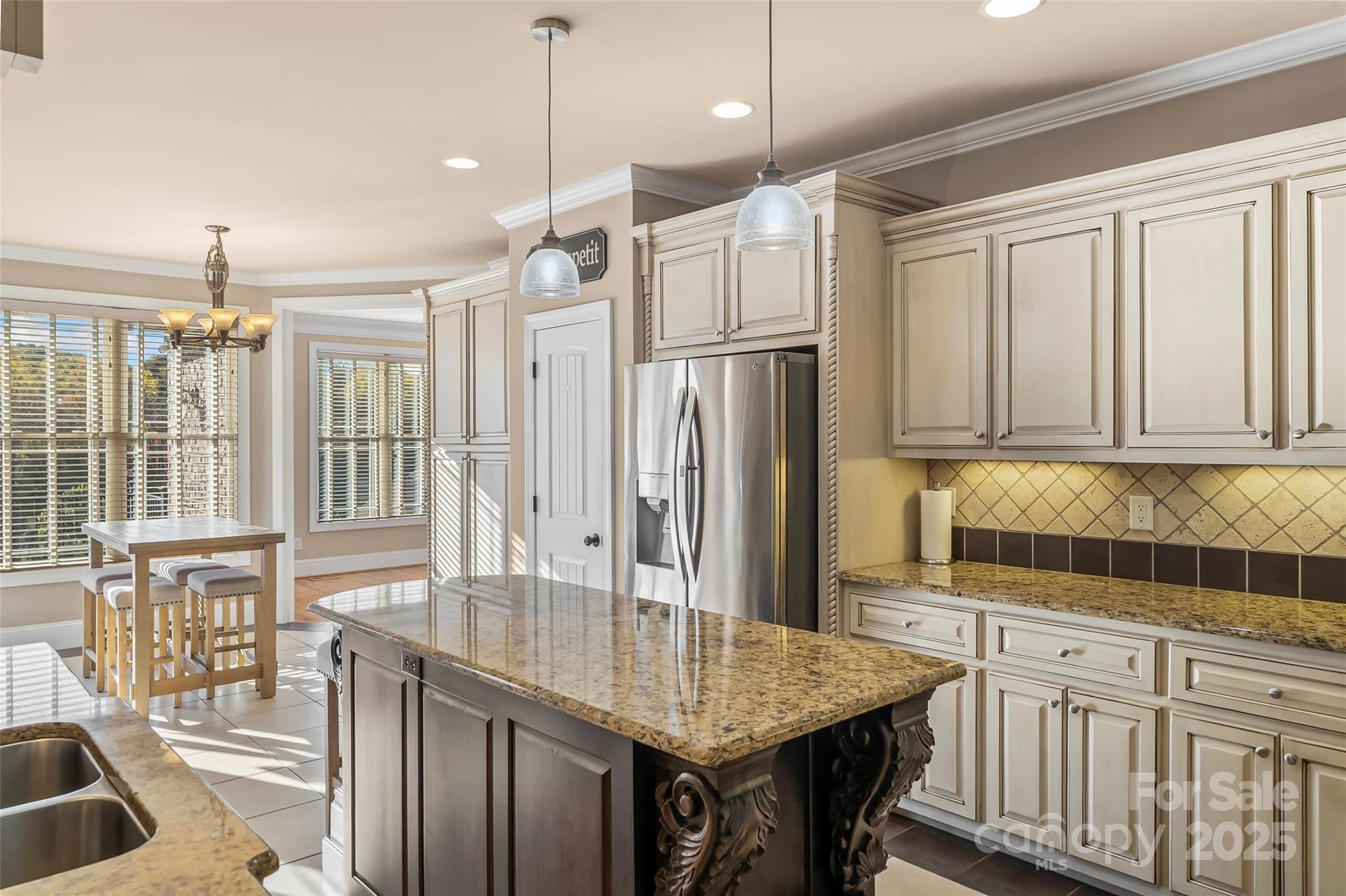 5836 Bakers Point Hickory, NC 28602 - Photo 9 of 48 a kitchen with stainless steel appliances granite countertop a sink refrigerator and cabinets