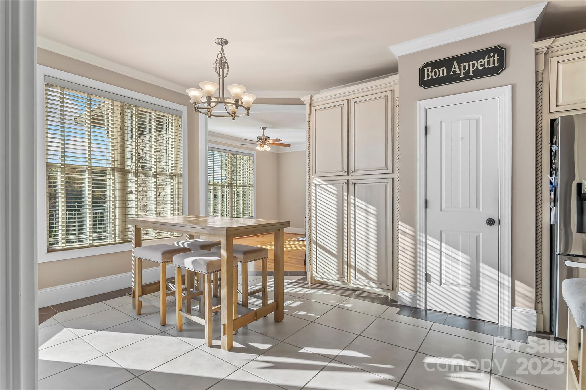 5836 Bakers Point Hickory, NC 28602 - Photo 10 of 48 a view of a dining room with furniture and a chandelier