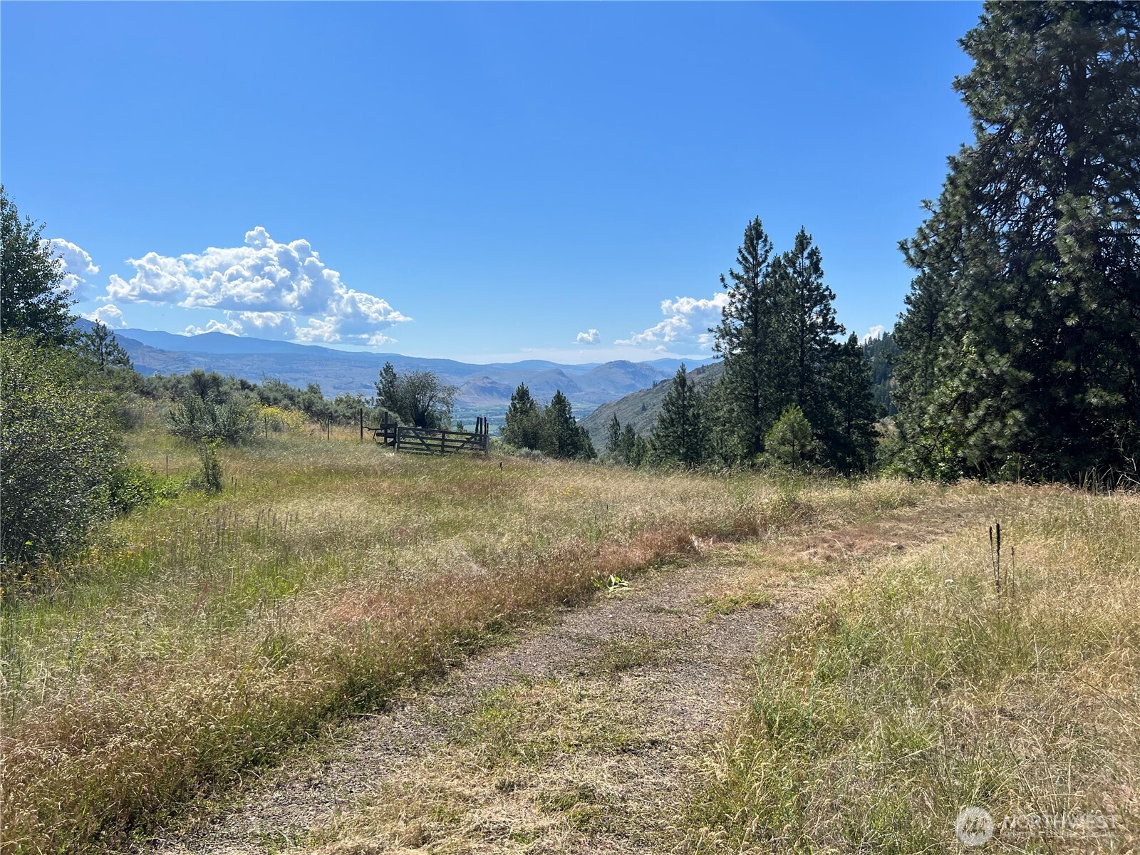 113 Eagles Bluff Road Oroville, WA 98844 - Photo 22 of 33 a view of a lake with a mountain in the background