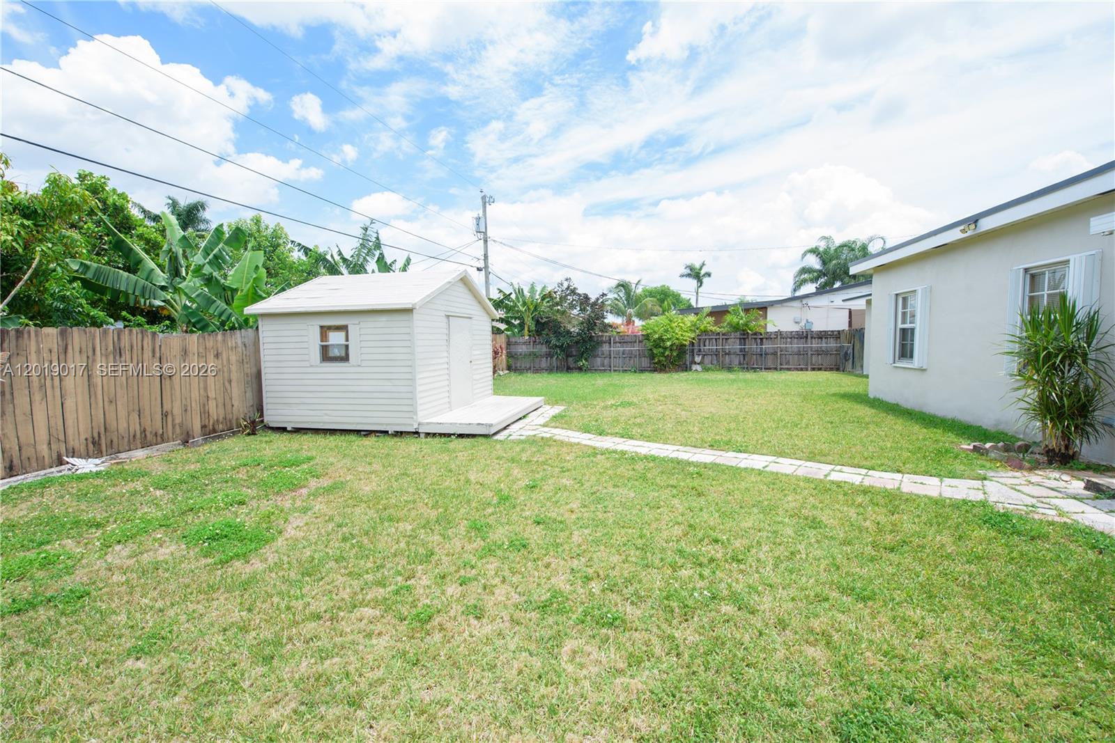 731 Northwest 17th Street Homestead, FL 33030 - Photo 17 of 29 a view of a backyard with a garden and plants