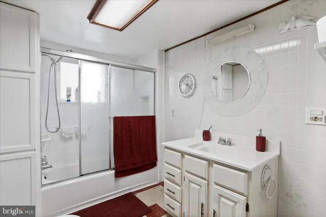 a kitchen with a refrigerator and a sink