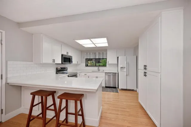 a view of a livingroom with wooden floor