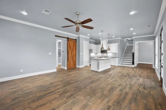 a view of kitchen with refrigerator and window
