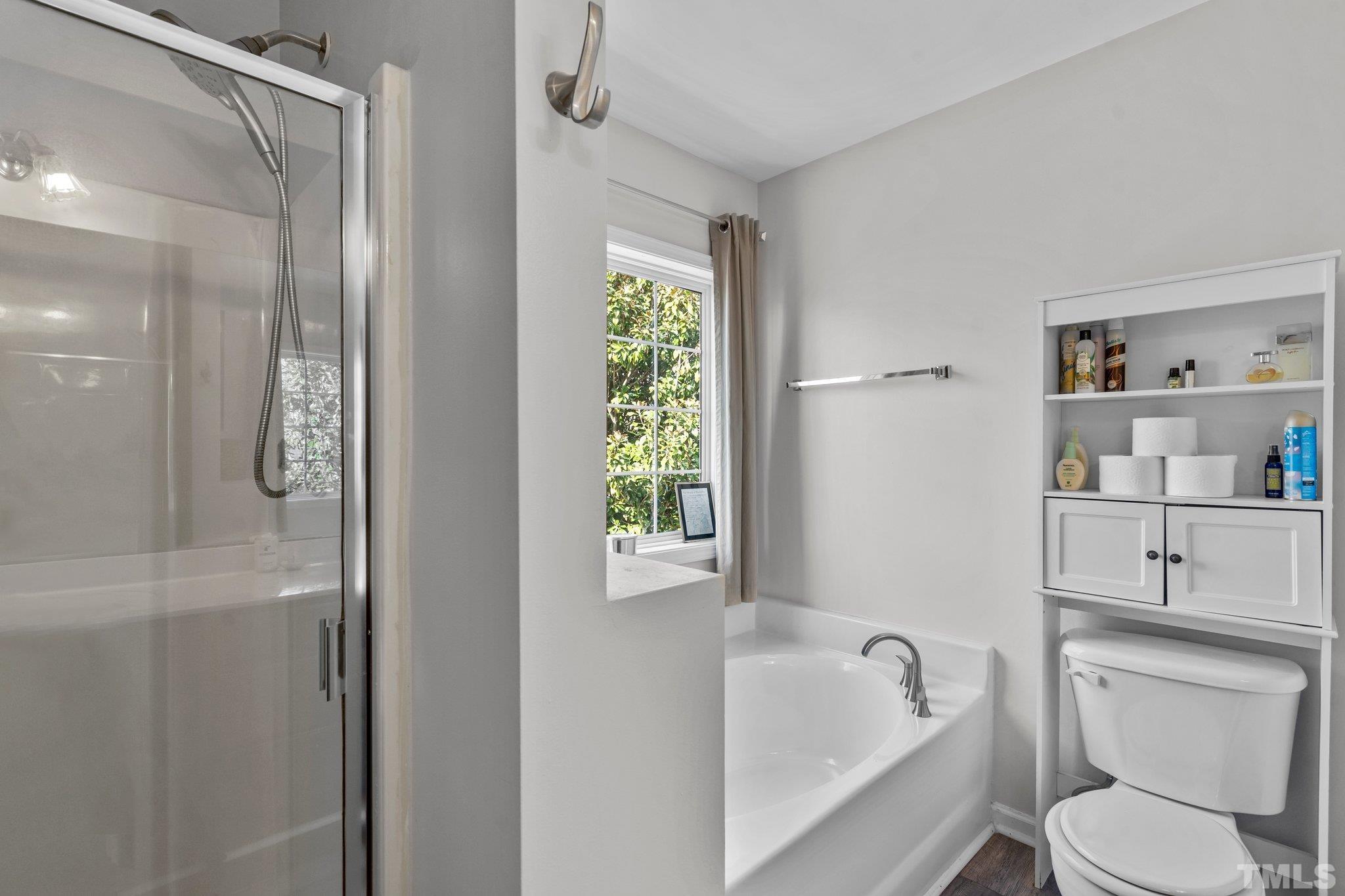 2359 Spruce Shadows Lane Raleigh, NC 27614 - Photo 19 of 34 a bathroom with a sink a toilet and shower