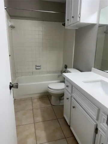 a bathroom with a sink a toilet and a bathtub
