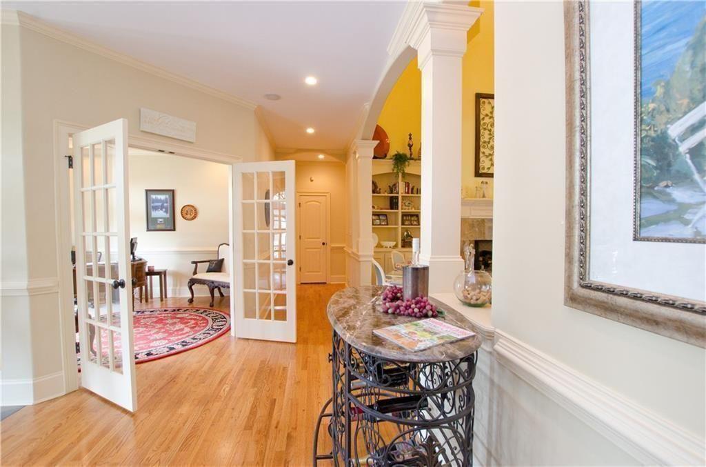 1331 Barrows Grove Road Madison, GA 30650 - Photo 12 of 47 a view of a dining room with furniture and wooden floor