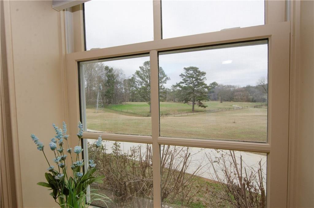 1331 Barrows Grove Road Madison, GA 30650 - Photo 20 of 47 a view of a glass door with a from a window
