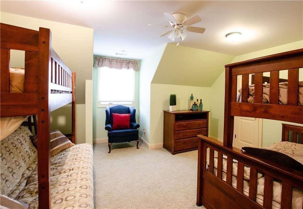 1331 Barrows Grove Road Madison, GA 30650 - Photo 22 of 47 a bedroom with furniture and a window