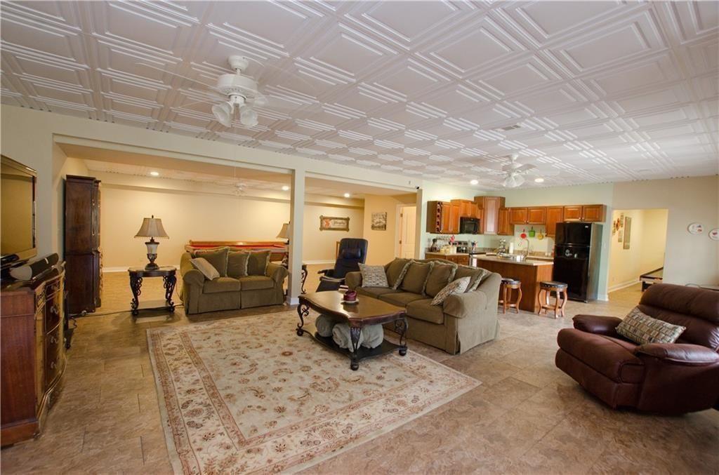 1331 Barrows Grove Road Madison, GA 30650 - Photo 24 of 47 a living room with furniture and a large window