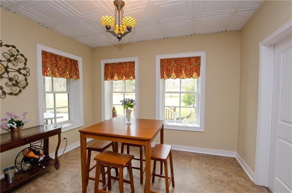 1331 Barrows Grove Road Madison, GA 30650 - Photo 25 of 47 a view of a dining room with furniture window and outside view