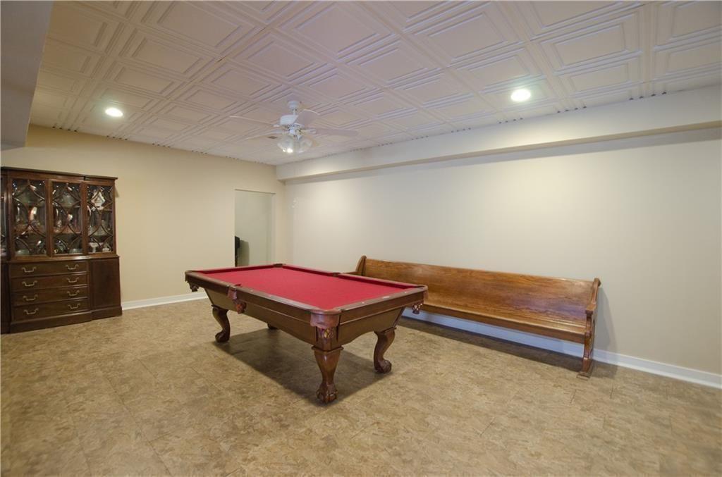 1331 Barrows Grove Road Madison, GA 30650 - Photo 26 of 47 a room with furniture pool table and wall paintings