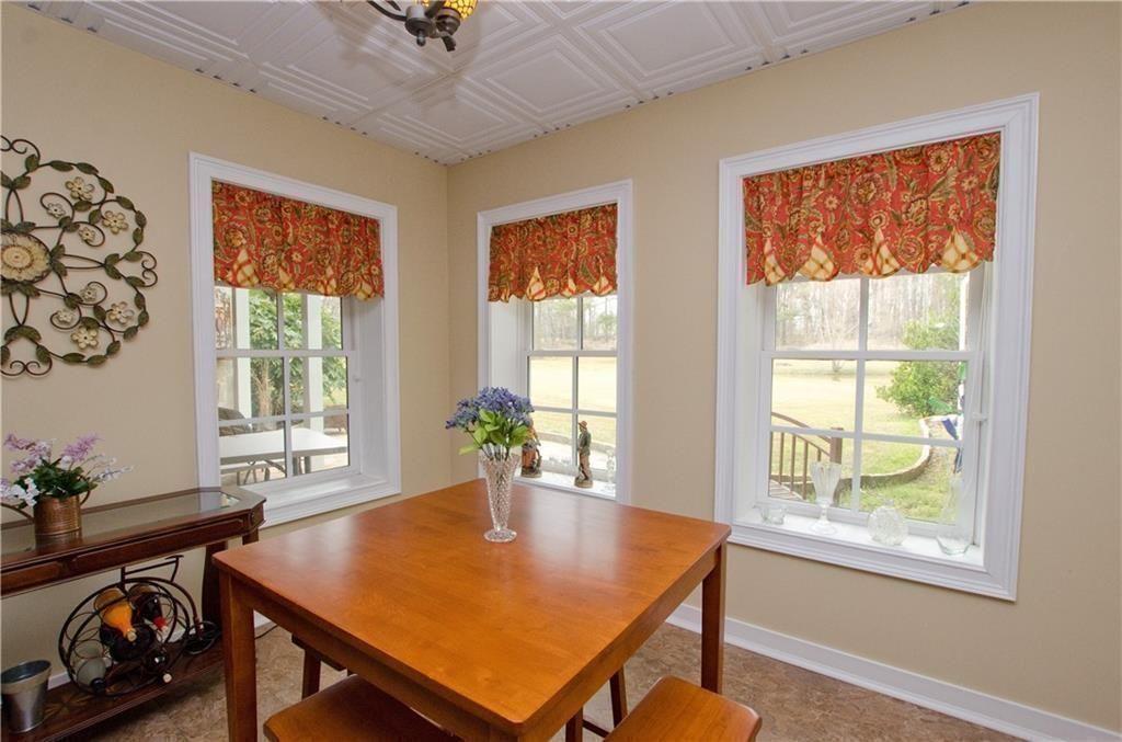 1331 Barrows Grove Road Madison, GA 30650 - Photo 27 of 47 a view of a dining room with furniture window and outside view
