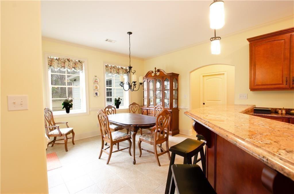 1331 Barrows Grove Road Madison, GA 30650 - Photo 28 of 47 a view of a dining room with furniture
