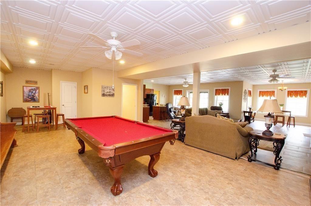 1331 Barrows Grove Road Madison, GA 30650 - Photo 29 of 47 a living room with furniture pool table and windows