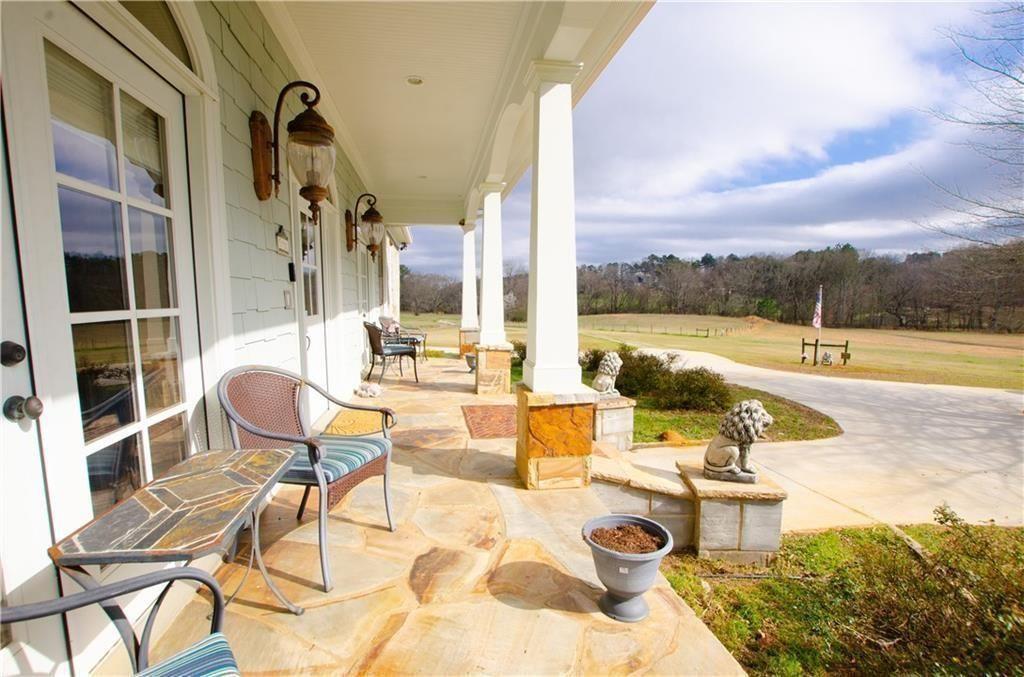 1331 Barrows Grove Road Madison, GA 30650 - Photo 34 of 47 a view of a swimming pool with outdoor seating and plants