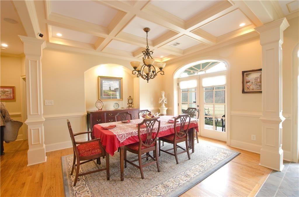 1331 Barrows Grove Road Madison, GA 30650 - Photo 4 of 47 a view of a dining room with furniture and wooden floor