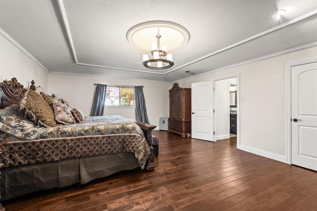 9552 Timberleaf Drive Dallas, TX 75243 - Photo 16 of 38 a bedroom with a bed and window