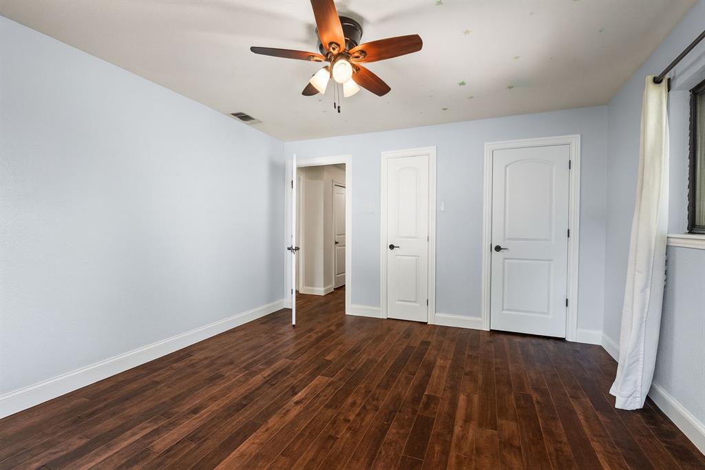 9552 Timberleaf Drive Dallas, TX 75243 - Photo 25 of 38 wooden floor in an empty room with a window