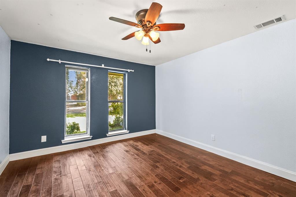 9552 Timberleaf Drive Dallas, TX 75243 - Photo 26 of 38 wooden floor in an empty room with a window