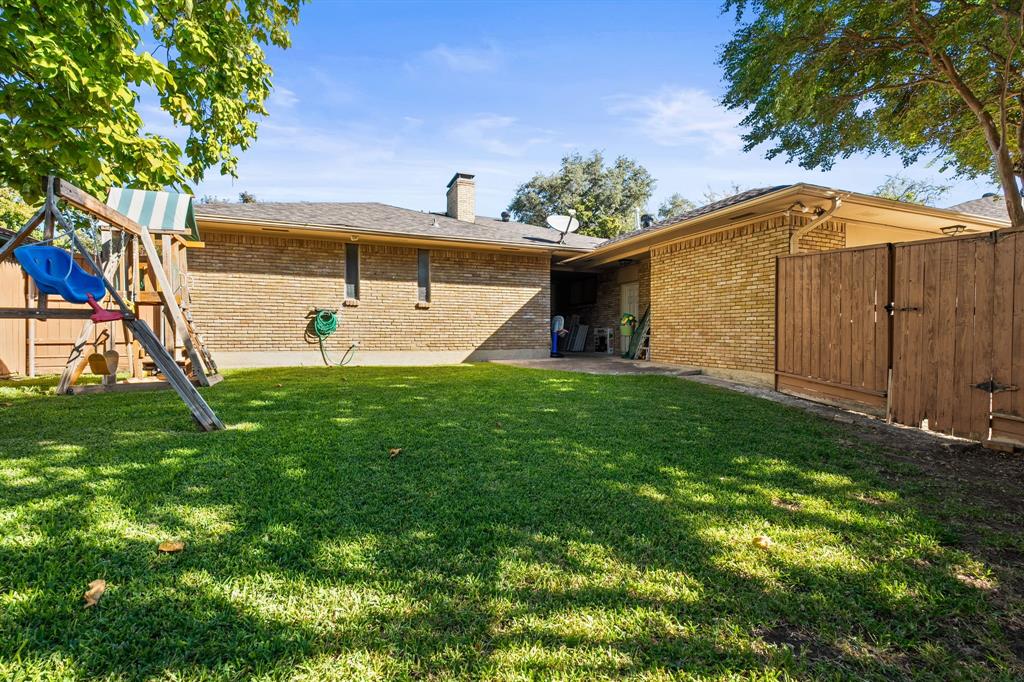 9552 Timberleaf Drive Dallas, TX 75243 - Photo 29 of 38 a view of a backyard with a garden and plants