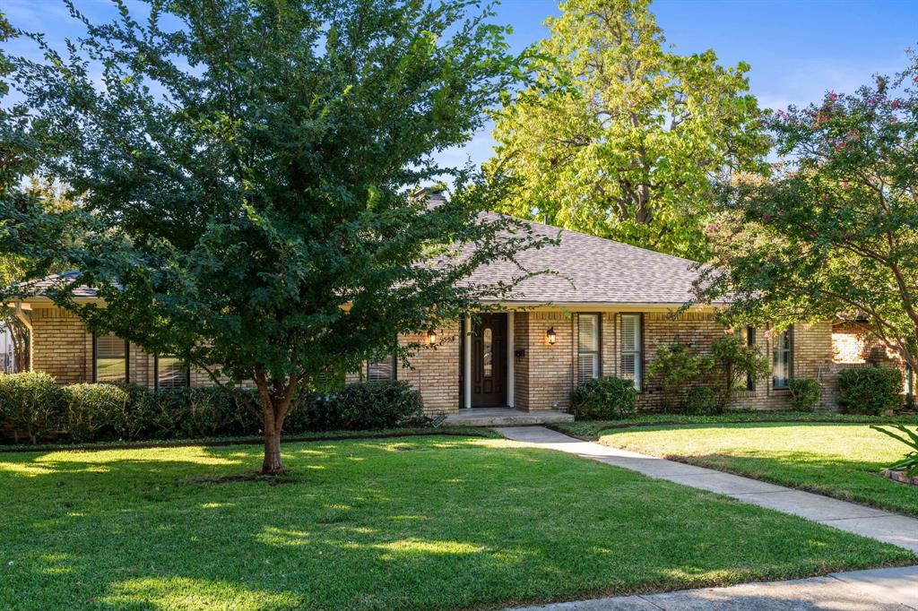 9552 Timberleaf Drive Dallas, TX 75243 - Photo 30 of 38 a front view of a house with a yard