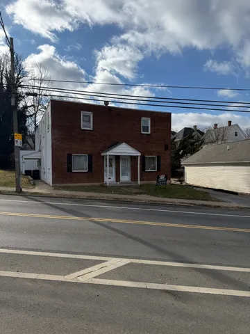 a view of a house with a street