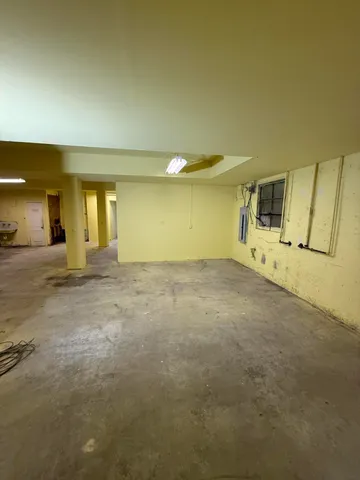 a view of a room with wooden walls