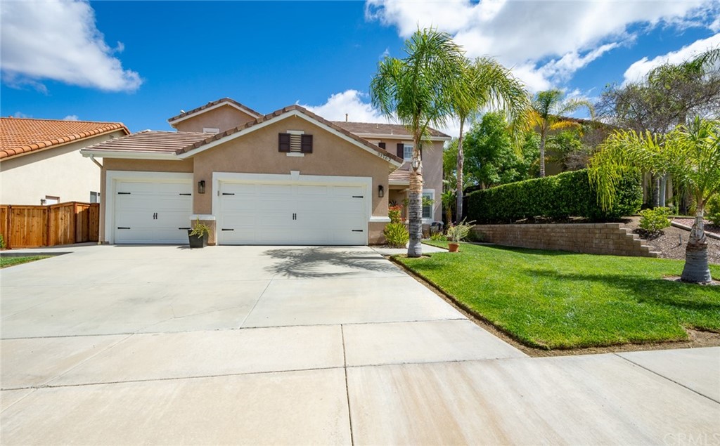33162 Fox Road Temecula, CA 92592 - Photo 1 of 1 a view of a white house with a yard and potted plants