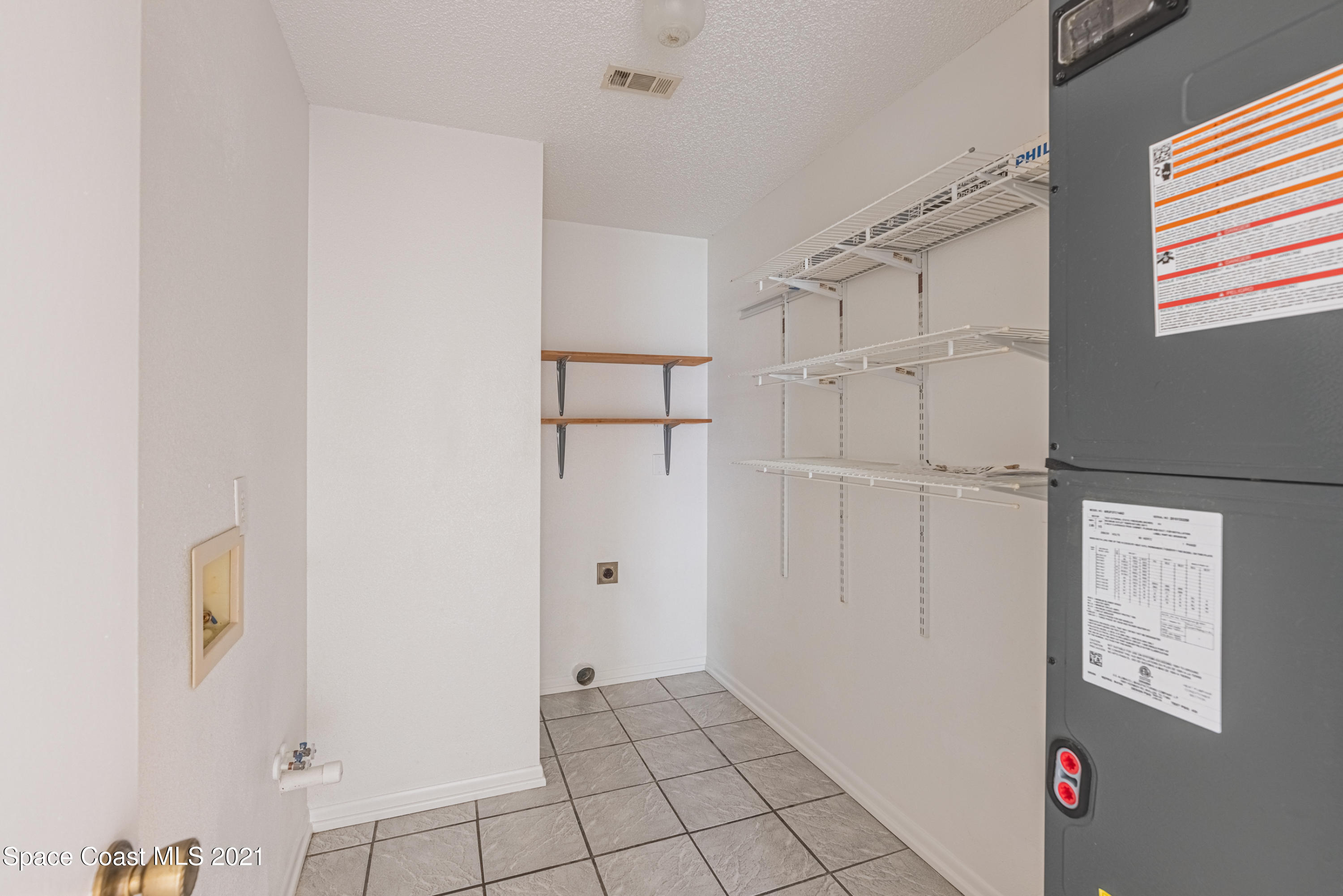 2021 Tallpine Road Melbourne, FL 32935 - Photo 14 of 44 Laundry Room