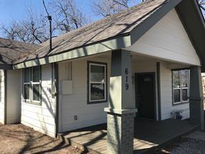 619 Bolivar Street Denton, TX 76201 - Photo 1 of 5 a front view of a house with parking area