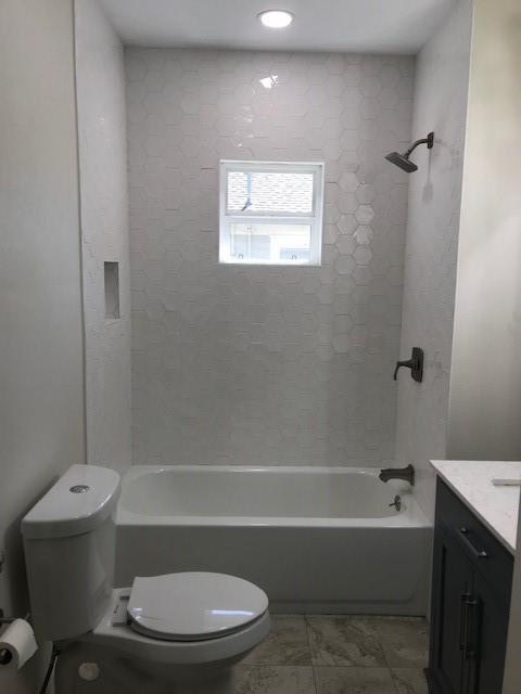 619 Bolivar Street Denton, TX 76201 - Photo 4 of 5 a bathroom with a toilet bathtub and shower