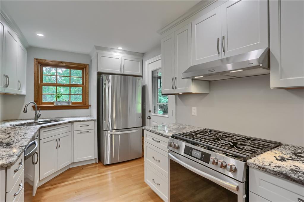 836 Harmony Road Pittsburgh, PA 15237 - Photo 27 of 46 a kitchen with stainless steel appliances granite countertop a sink stove and refrigerator