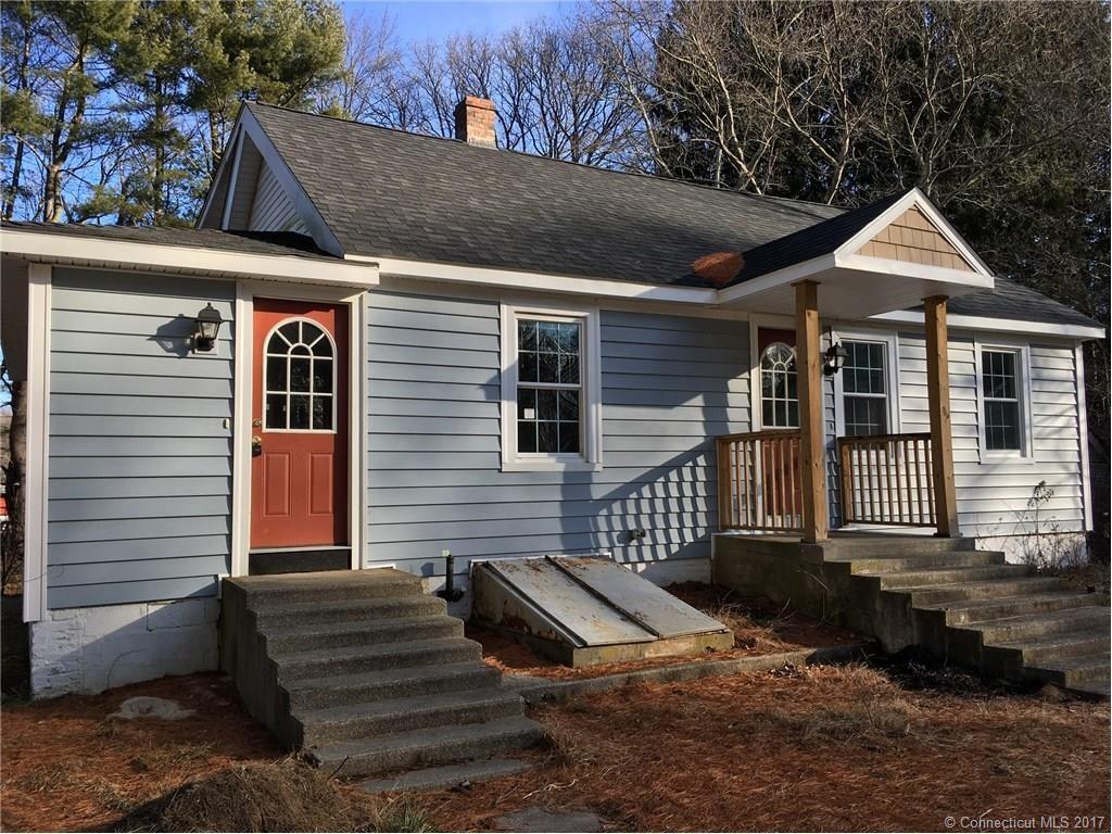 1044 Norwich Road Plainfield, CT 06374 - Photo 1 of 1 a front view of a house with a yard