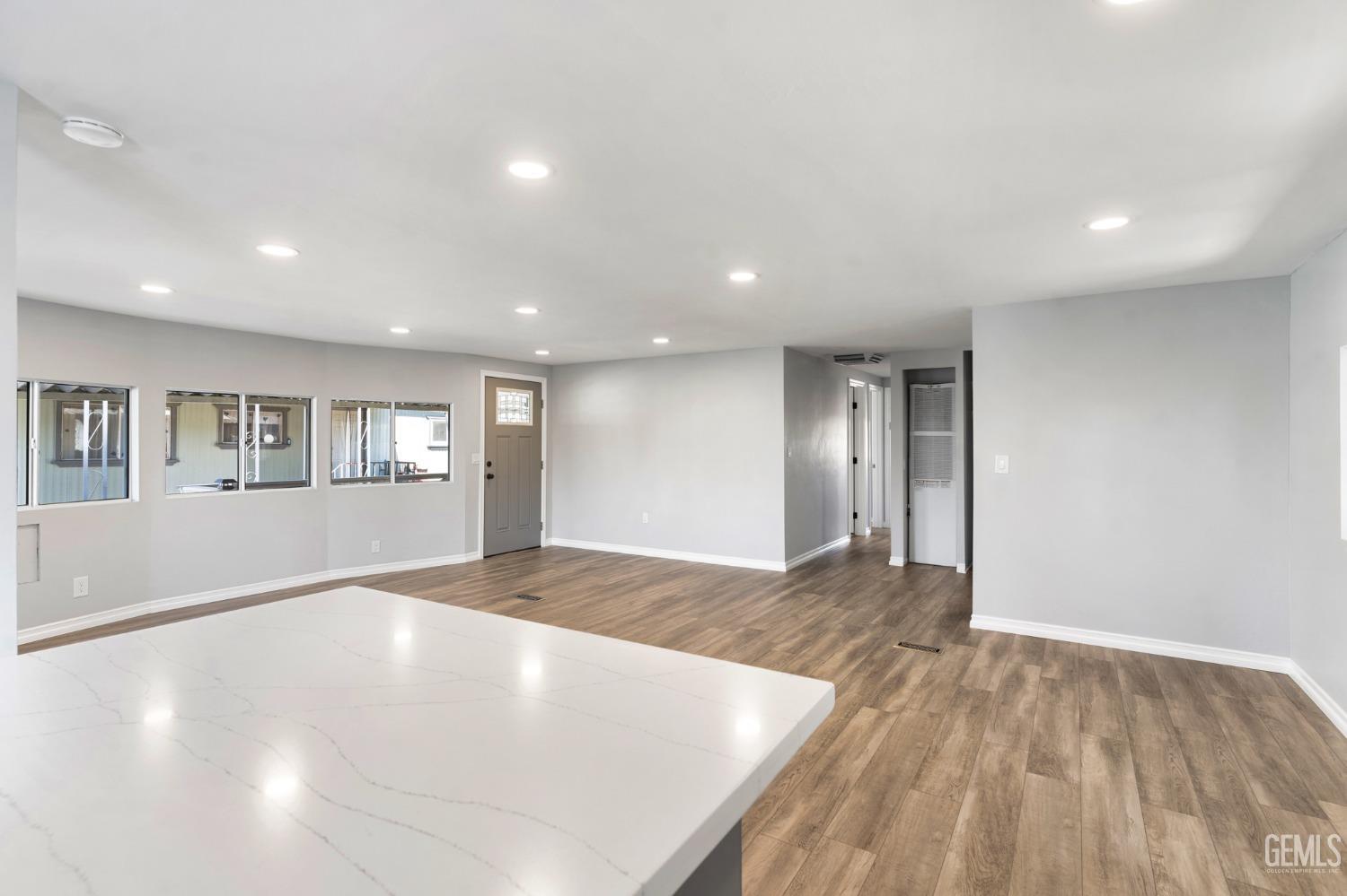 Undisclosed Address Bakersfield, CA 93306 - Photo 11 of 25 a view of an empty room with wooden floor