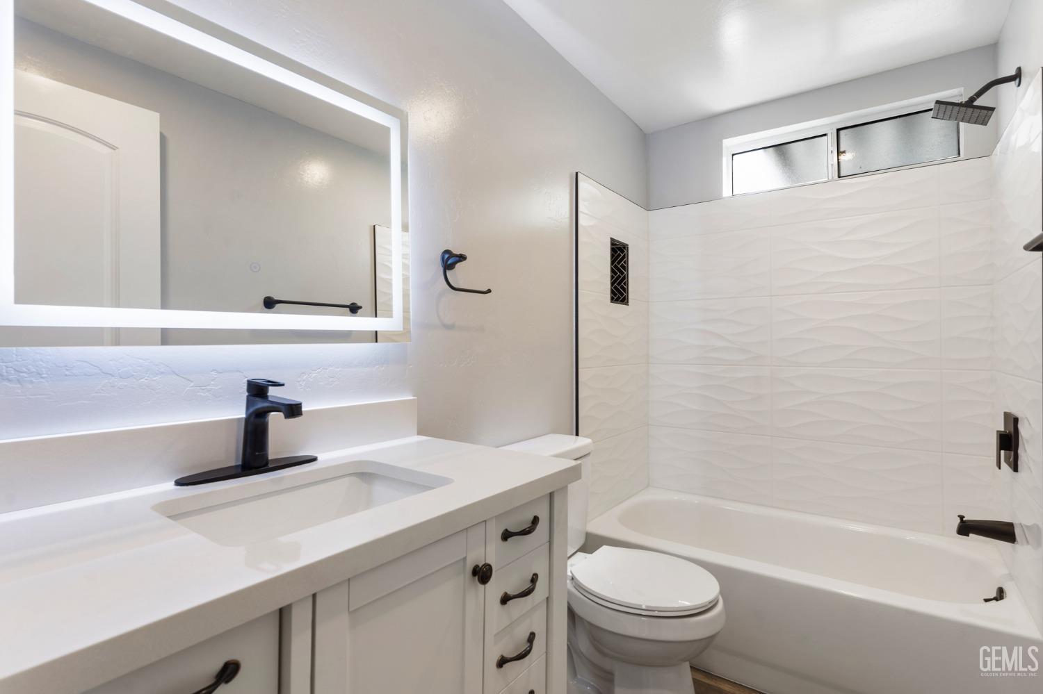 Undisclosed Address Bakersfield, CA 93306 - Photo 20 of 25 a bathroom with a sink a toilet and a bathtub