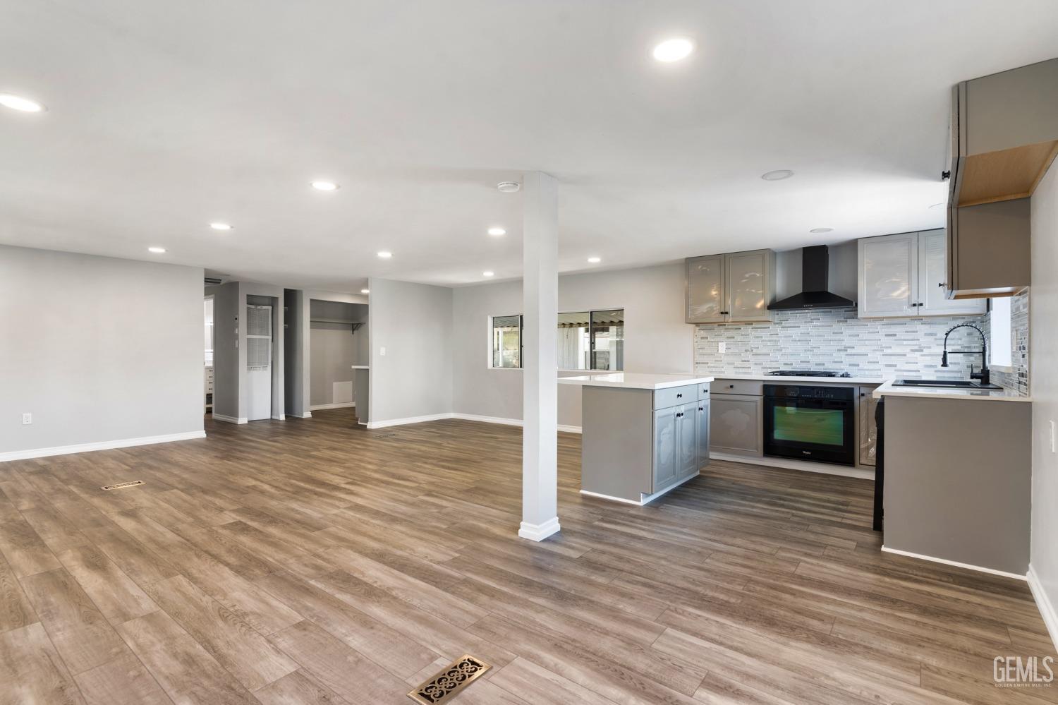 Undisclosed Address Bakersfield, CA 93306 - Photo 10 of 25 a large kitchen with kitchen island a sink stainless steel appliances and cabinets
