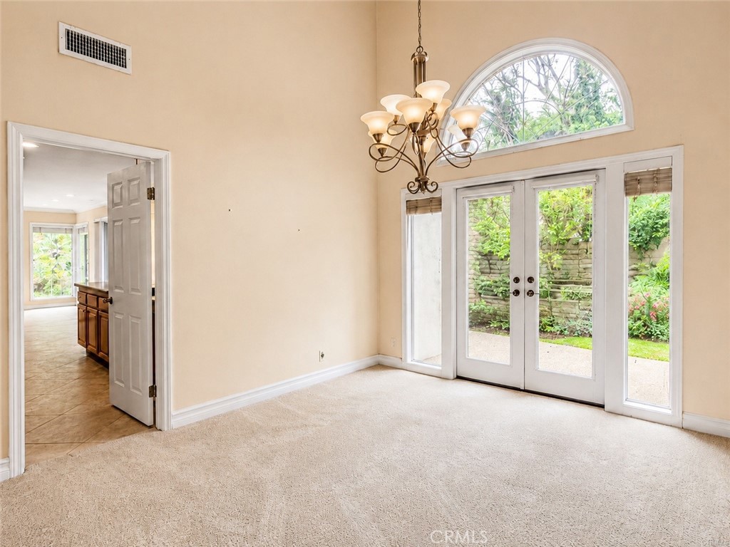 2811 North Roxbury Street Orange, CA 92867 - Photo 5 of 22 an empty room with windows and outdoor view